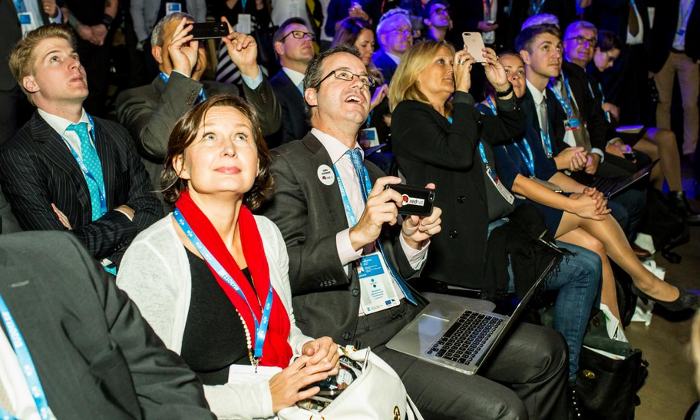 The author and other delegates watching an acrobatics performance at the EU digital government meeting. (Photo courtesy of Estonia's organizer)