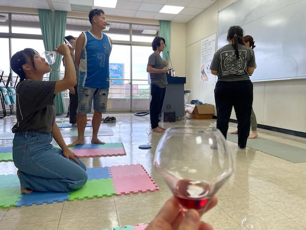 Image from the author attending Wine Yoga session